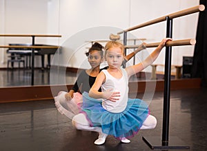 Two little girls practicing ballet elements