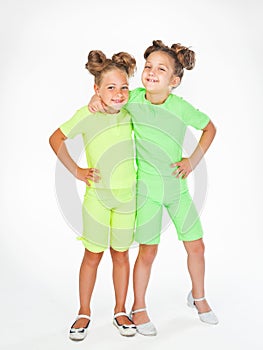 Two little girls in similar fancy garb photo