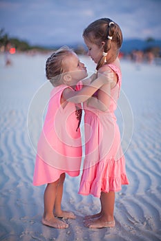 Two little girls at tropical beach in Philippines
