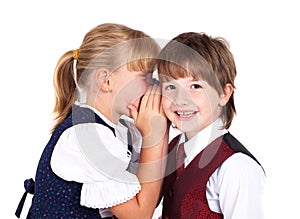Two little kids telling secrets