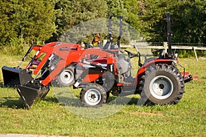 Two little red tractors for sale