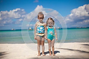 Two little sisters at tropical beach