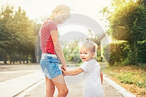 Two little sisters walk together
