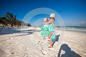 Two little sistershaving fun at tropical beach in