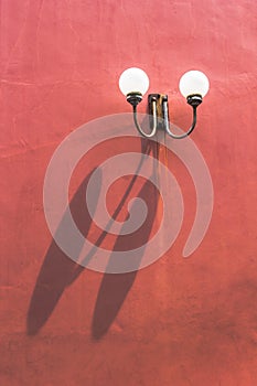 Two llight on red wall