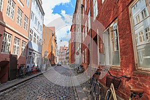 Two locked bicycycles in Copenhagen colorful old town street