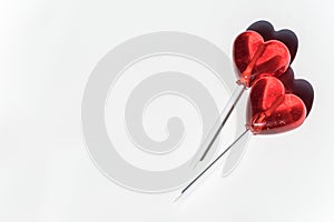 Two lollipops. Red hearts. Candy. Love concept. Valentine day