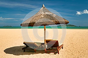 Two lonely loungers on the deserted beach of Hainan Island.