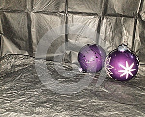 Two lonely purple baubles