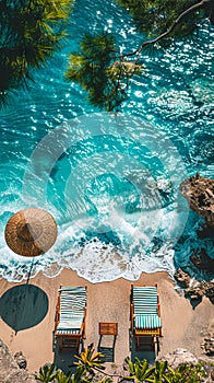 Two lounge chairs on the beach with umbrellas