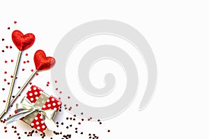 Two love magic wands and a gift. Valentine`s Day concept. Copy space