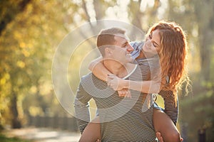 Two lovers in the autumn park