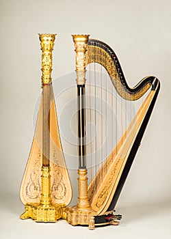 Two Lyon and Healy Pedal harps in bronze and gold