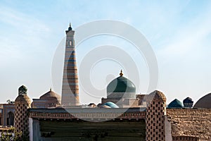 Two of main attractions of Khiva Uzbekistan : Islam Khodja minaret and Pahlavan Mahmoud mausoleum with unique green dome