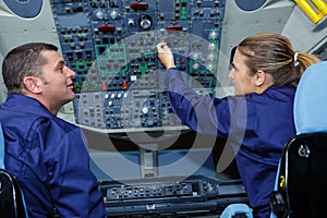 two maintenance engineers inside airplane