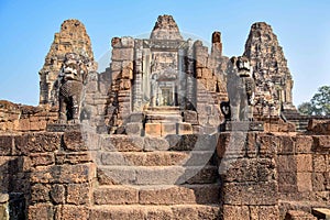 Two majestic stone lion statues guarding stairs to ancient angkor wat temple entrance, cambodia