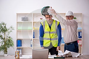 Two male architects working on the project