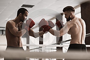 Two Male Boxers during Sparring on Boxing Ring