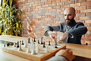 Two male chess players on competition