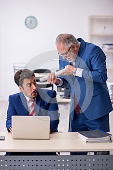 Two male colleagues working in the office