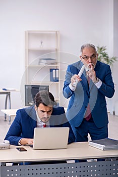 Two male colleagues working in the office