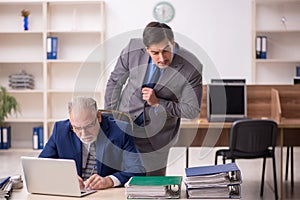 Two male colleagues working in the office