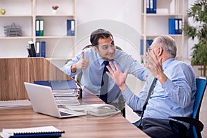 Two male colleagues working in the office