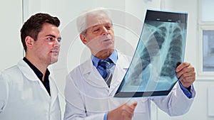 Two male doctors look at x-ray