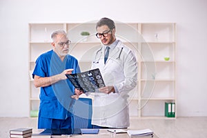 Two male doctors radiologists working in the clinic