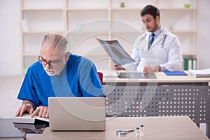 Two male doctors working in the clinic