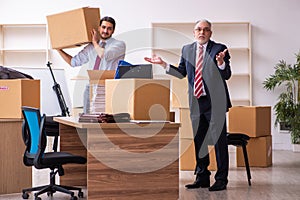 Two male employees in relocation concept