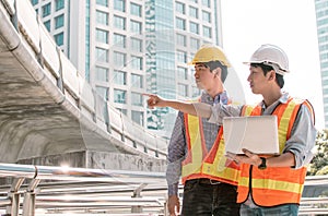 Two engineers discuss about the projects and construction site