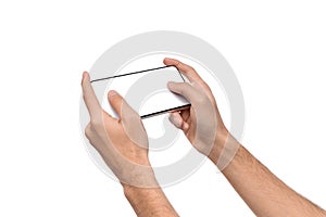 Two male hands holding smartphone with blank screen, playing games