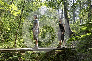 Two Male Hikers Going Into National Forest