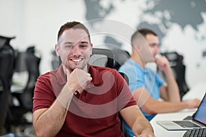 Two male software developers working on computer