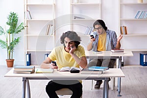 Two male students in the classroom