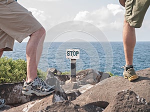 Two Males and Stop Sign