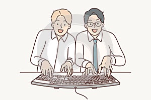 Two man computer geeks use keyboard to type code at same time to develop programs or applications