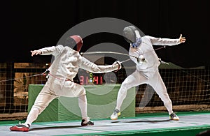 Two man fencing athletes fight