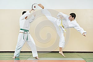 Two man at taekwondo exercises