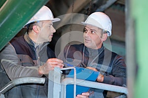 two man worker in factory photo