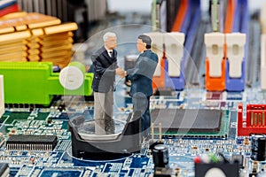 Two managers on computer board