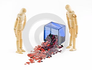 Two Mannequins Look at Spilled Box of Hearts