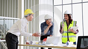 Two mans inspectors and architects discuss with head engineer about construction project