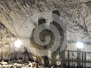 Two mans shadows on a wall in Ialominta cave