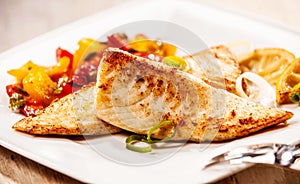 Two marinated grilled fresh tilapia fillets