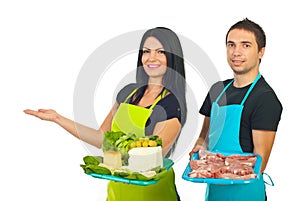 Two market workers making presentation