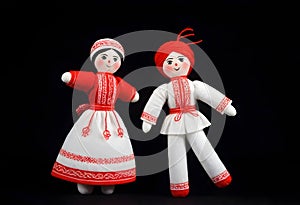 two martenitsa dolls in traditional ukrainian clothing