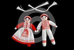 two martenitsa dolls in traditional ukrainian clothing