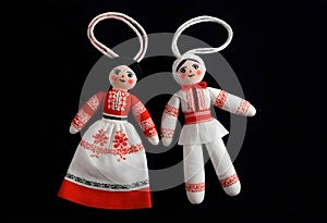 two martenitsa dolls in traditional ukrainian clothing